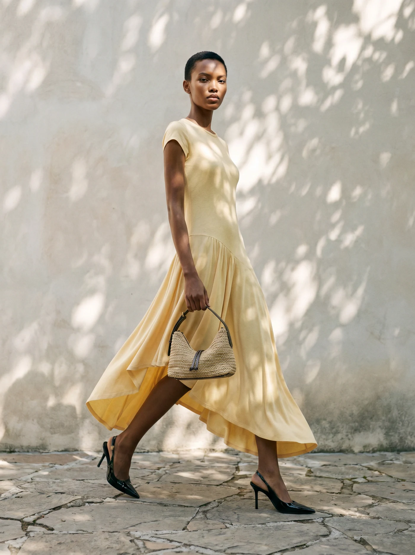 Sun silk dress on an AI model in an outdoor editorial scene