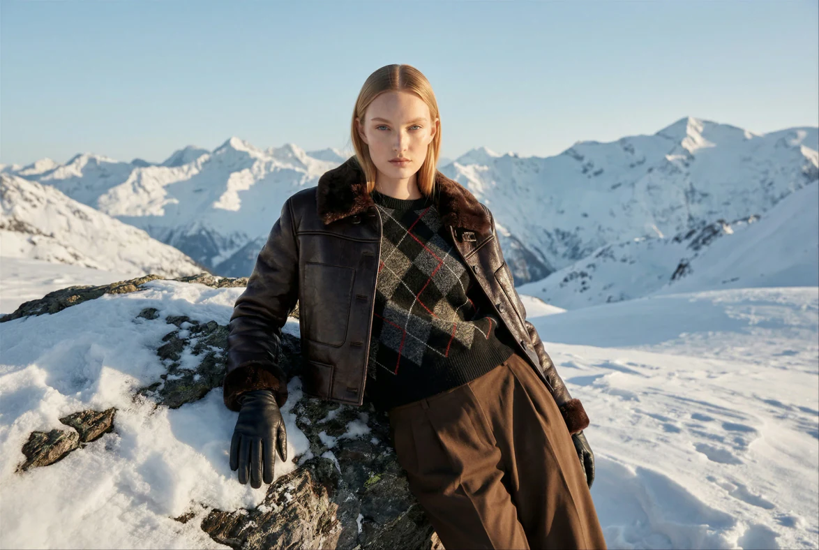 On-location fashion photoshoot in snowy mountains — the kind of production the cost breakdown covers