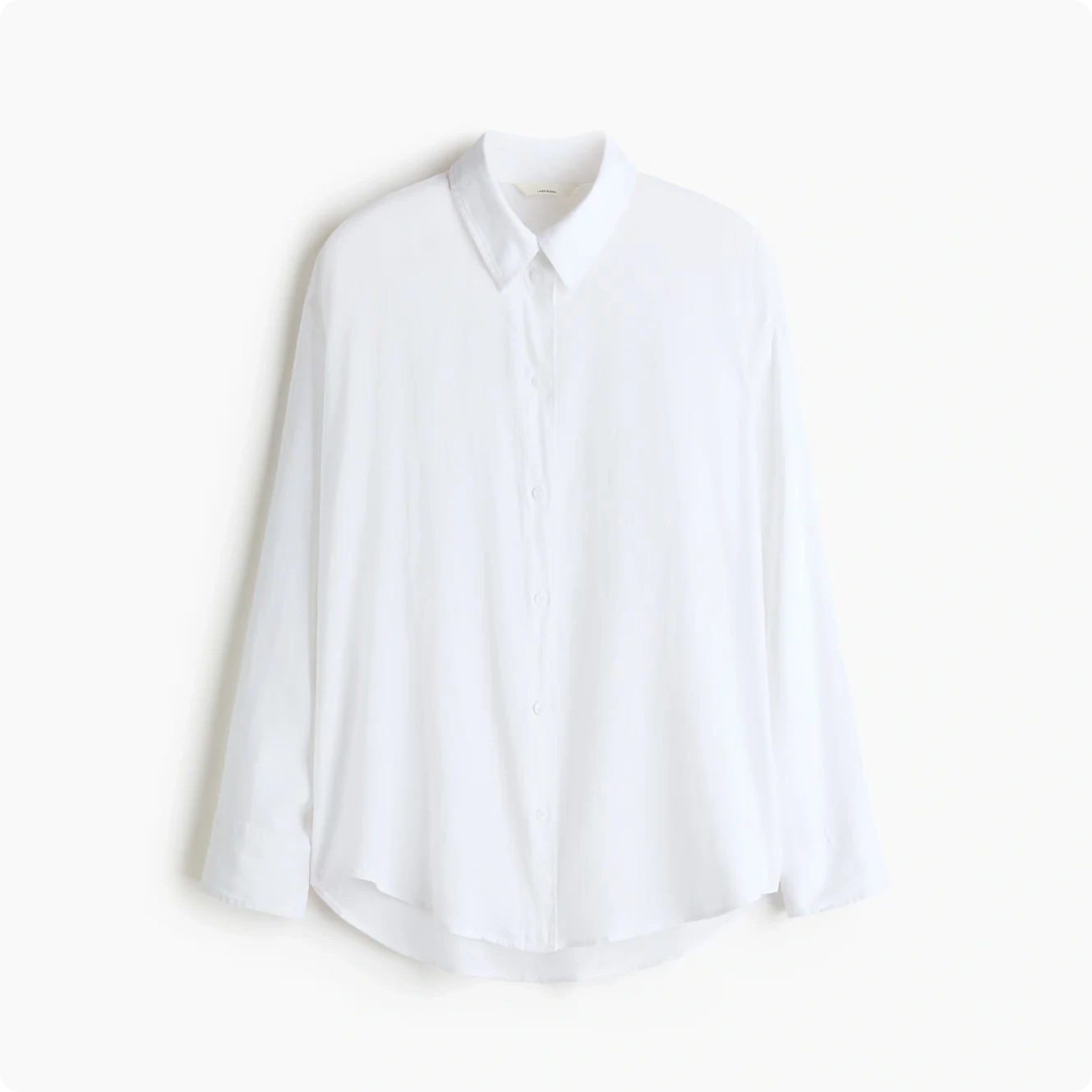 Flat lay packshot of a white button-up shirt on a neutral background
