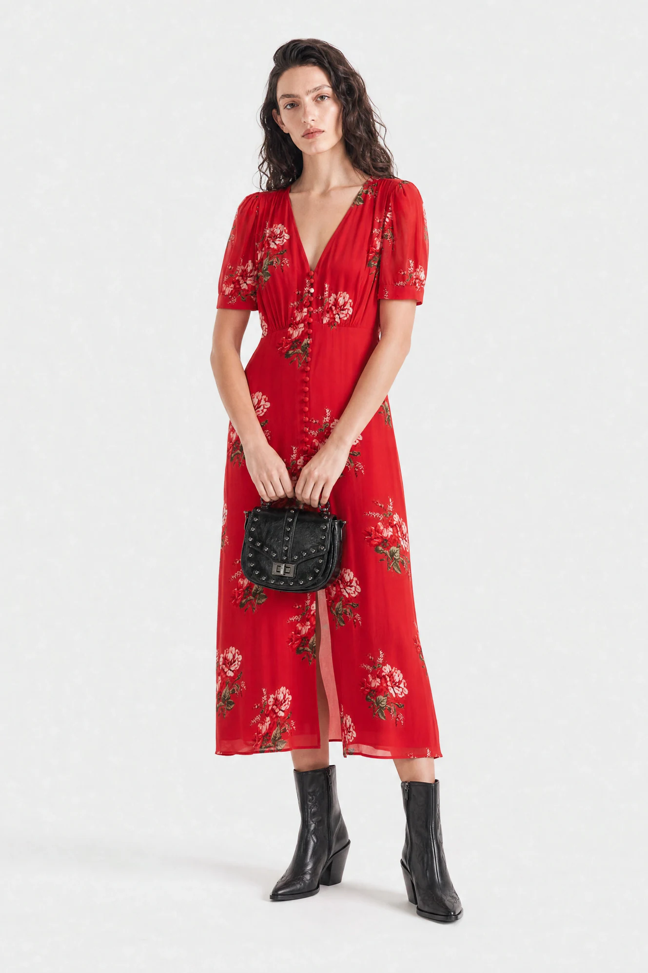 AI photoshoot output: the red floral dress on-model, styled with western boots and a studded bag