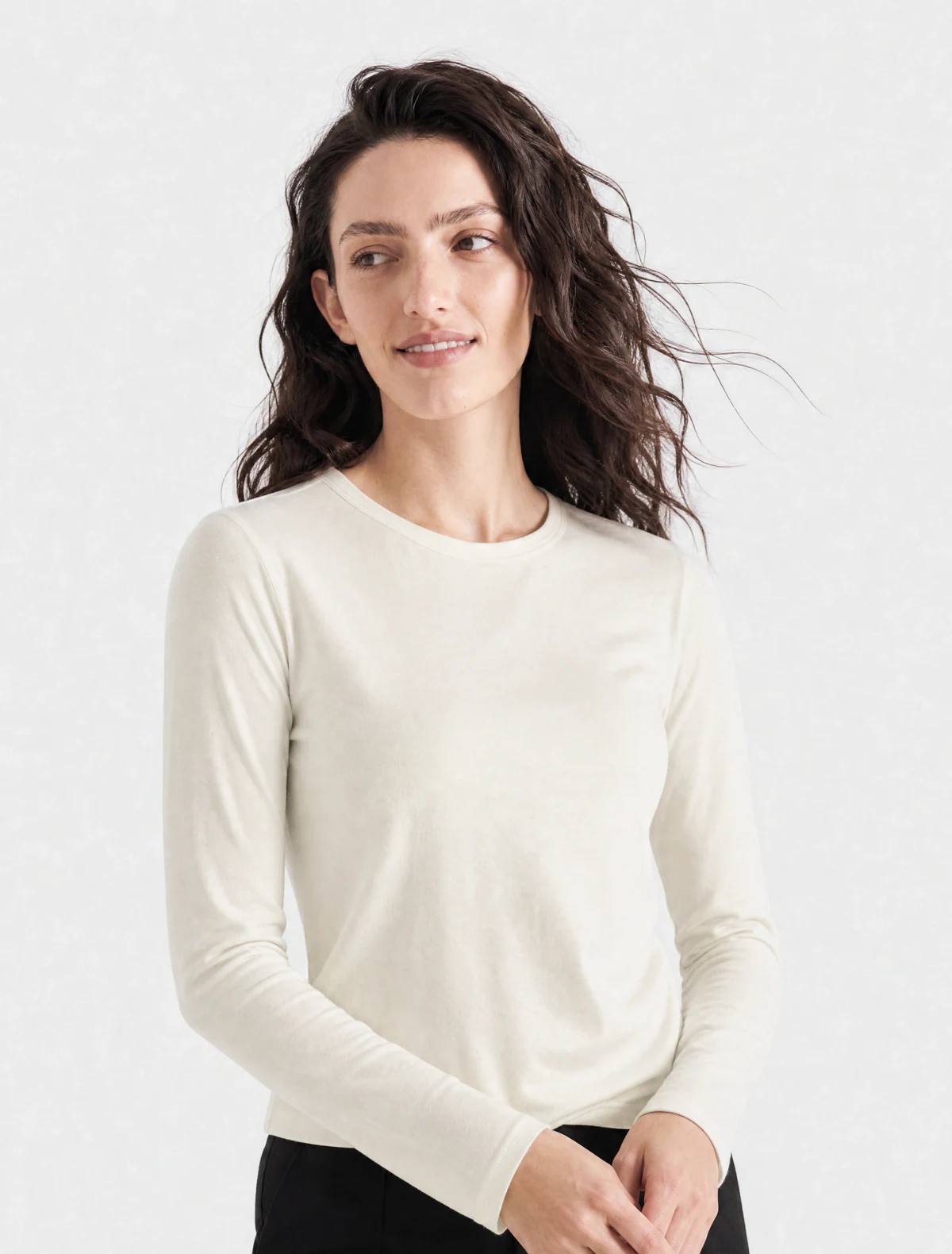 AI-generated on-model image: ivory fine-gauge knit with black trousers