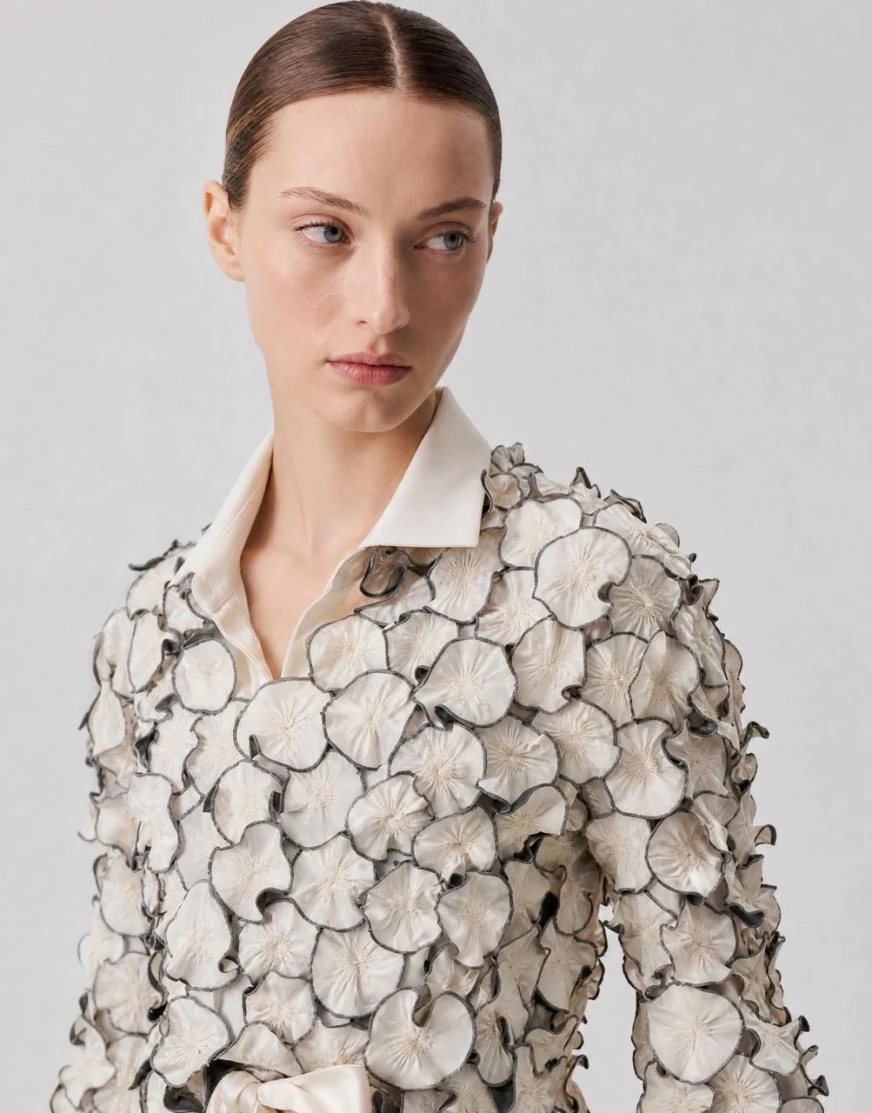 Sculpted blouse converted from a ghost mannequin shot to a live AI model video